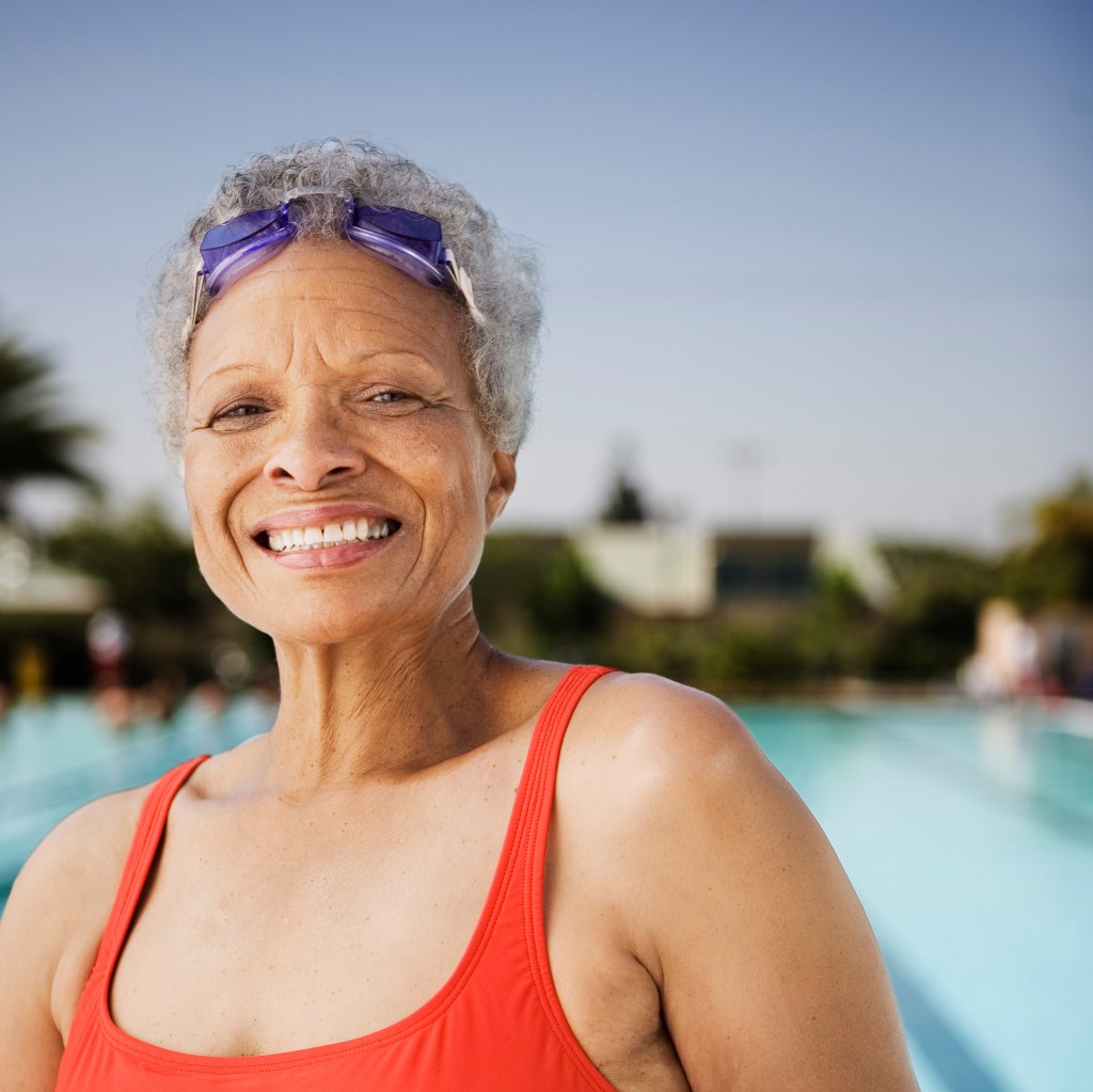 african american woman smiling in swimsuit